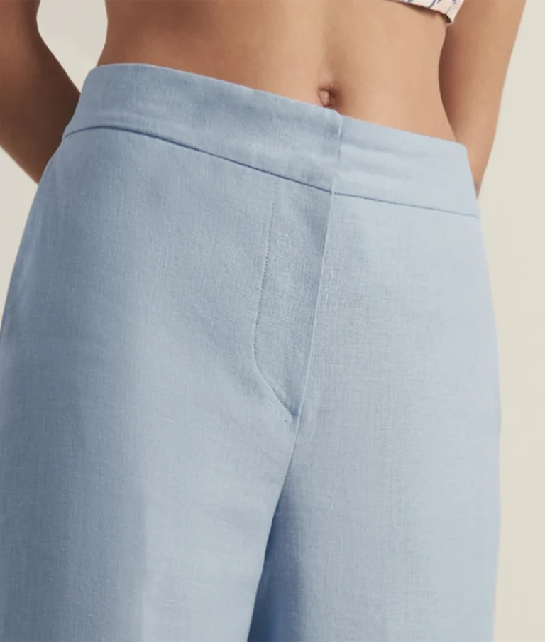 Blue linen mid rise trouser crafted from single-fabric linen construction.