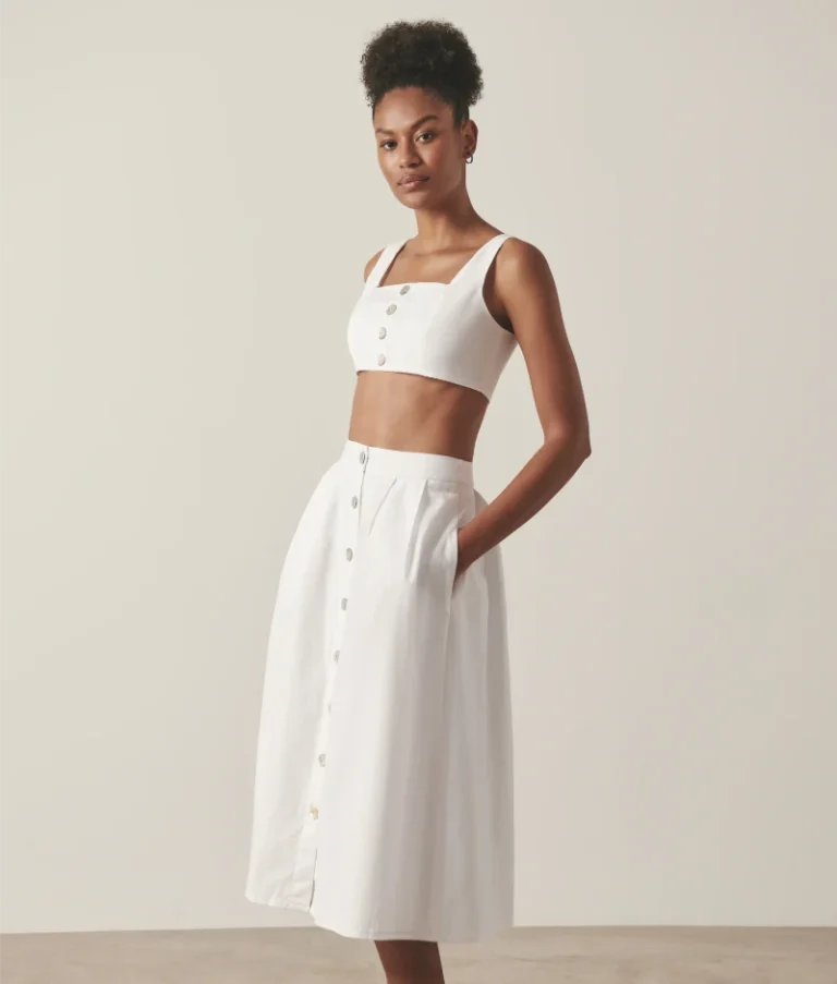 White organic cotton midi skirt with full lining for enhanced structure and longevity.