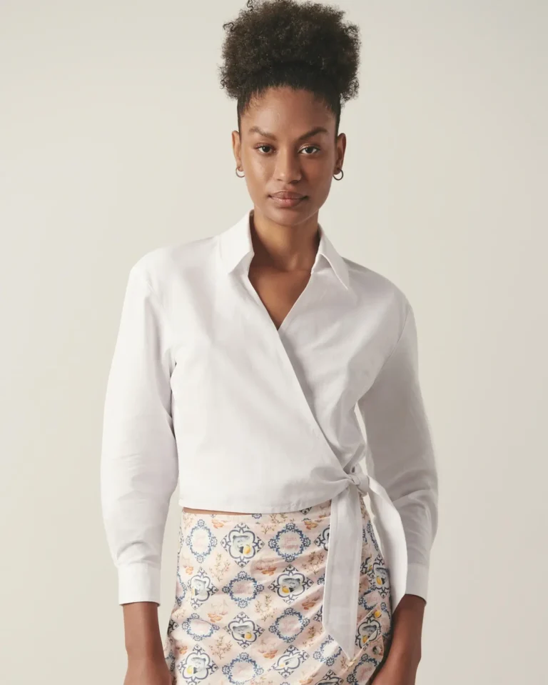 Front view of white organic cotton wrap shirt with waist tie.
